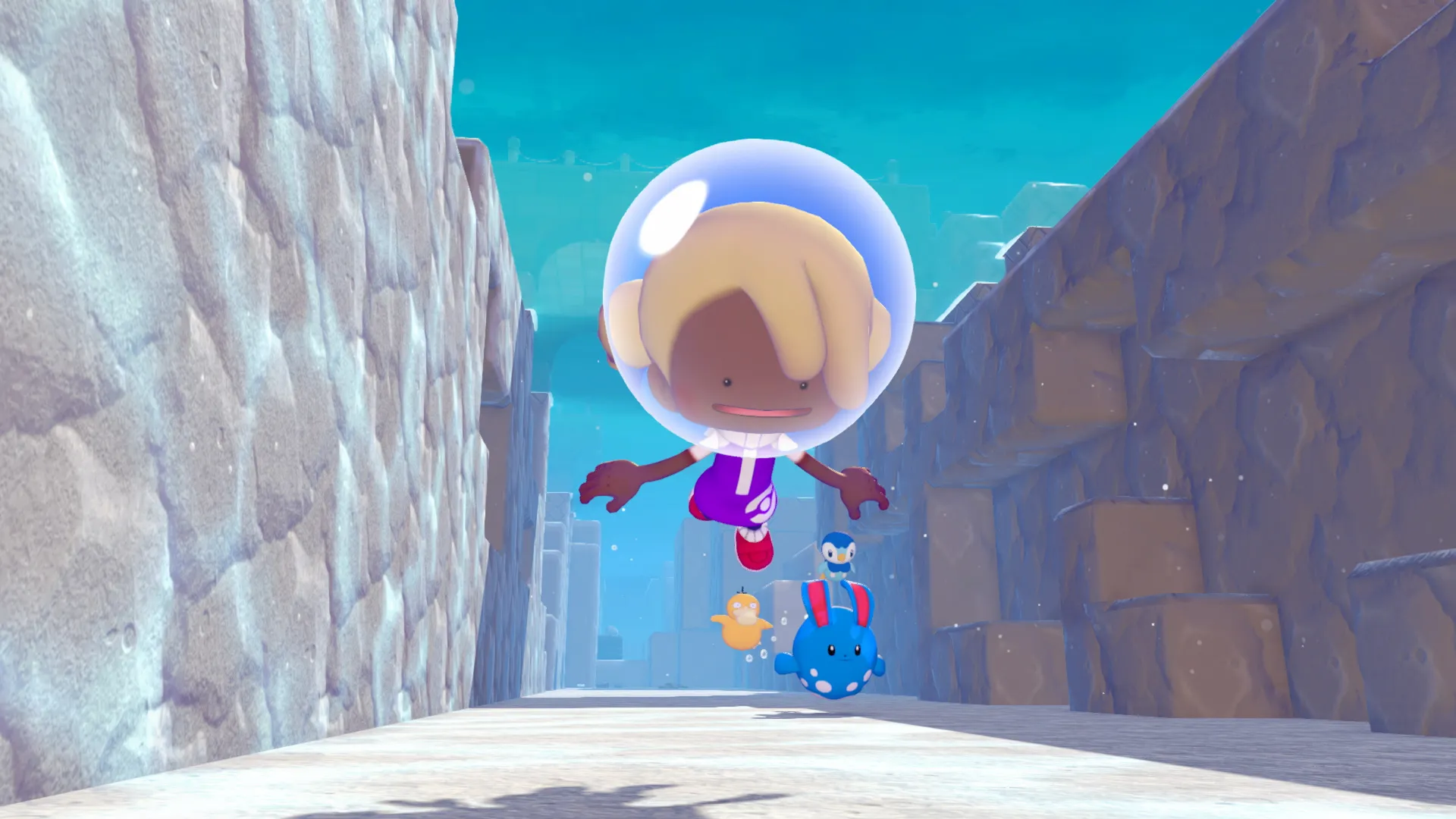Il giocatore di Pokémon Pokopia nuota sott'acqua all'interno di un canyon roccioso, seguito da Psyduck, Piplup e Marill.
